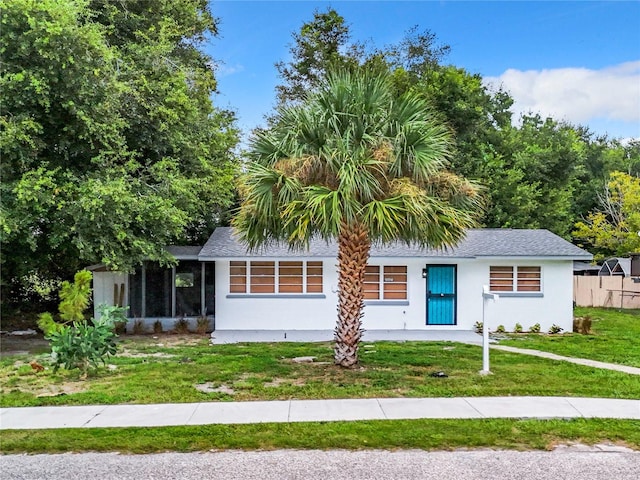 view of front of property with a front lawn