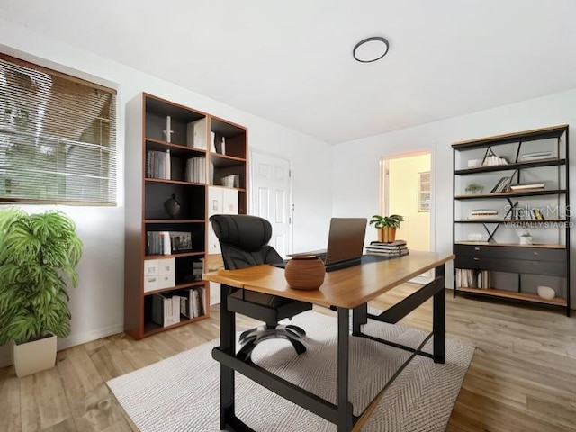 office area with light hardwood / wood-style flooring