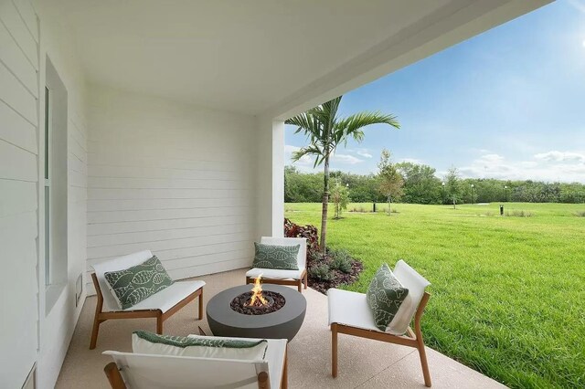 9955 Key Haven Rd, Seminole, FL 33777 - view of patio with an outdoor fire pit
