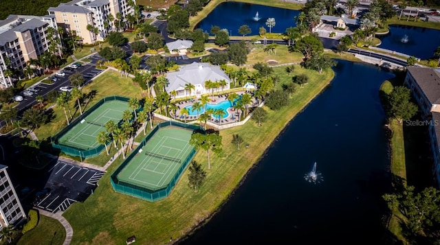 birds eye view of property with a water view