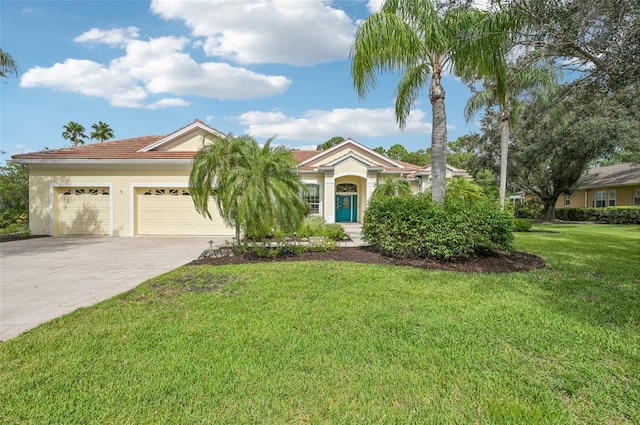 view of front facade with a garage and a front lawn