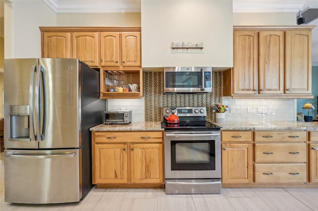 kitchen featuring stainless steel appliances, crown molding, decorative backsplash, and light stone countertops