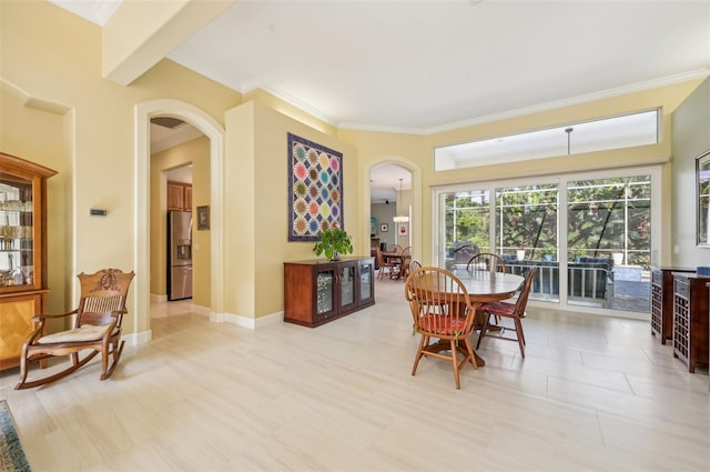 dining room with beam ceiling and light tile patterned floors