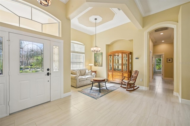 entryway featuring crown molding and light tile patterned flooring