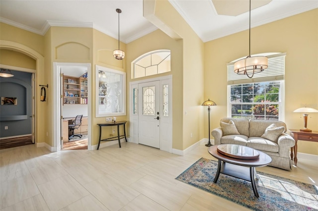 tiled foyer featuring crown molding