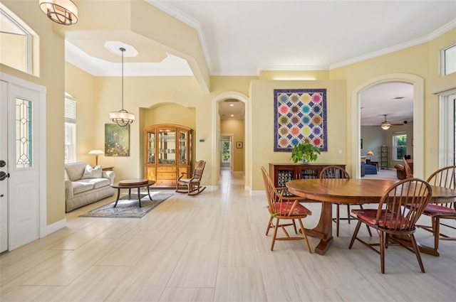 dining room with ceiling fan with notable chandelier, light tile patterned floors, and plenty of natural light