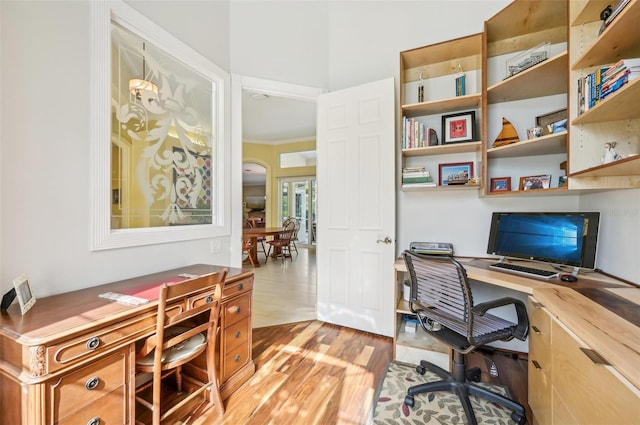 office space featuring light hardwood / wood-style flooring and ornamental molding