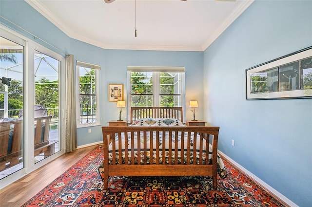 bedroom featuring crown molding and hardwood / wood-style flooring