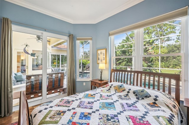 bedroom with wood-type flooring and ornamental molding