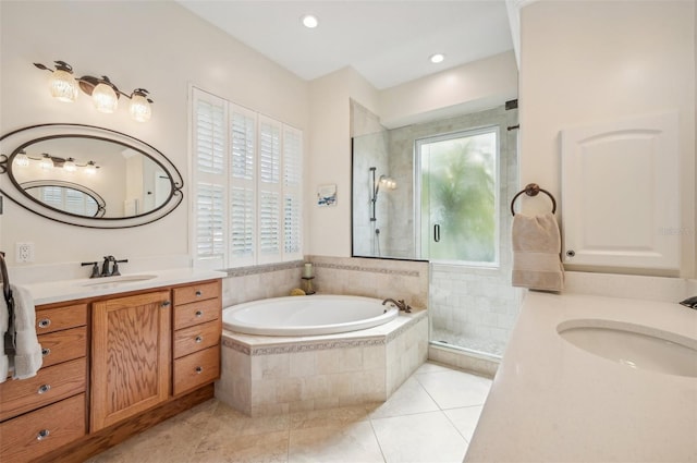 bathroom featuring plus walk in shower, tile patterned flooring, and vanity