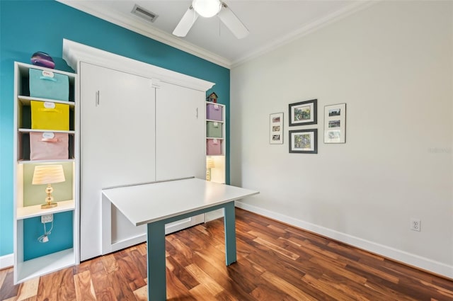 home office with ceiling fan, hardwood / wood-style floors, and ornamental molding