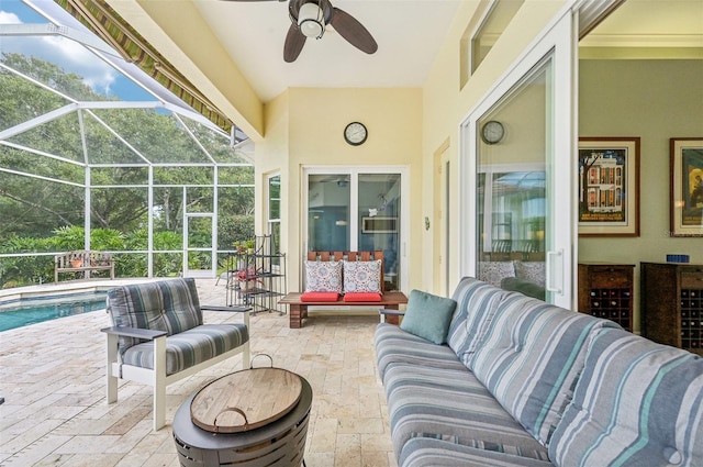 view of patio / terrace with ceiling fan, an outdoor living space, and a lanai