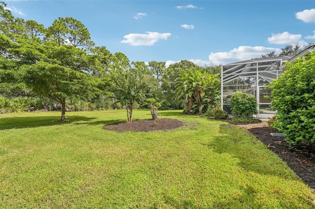 view of yard featuring glass enclosure