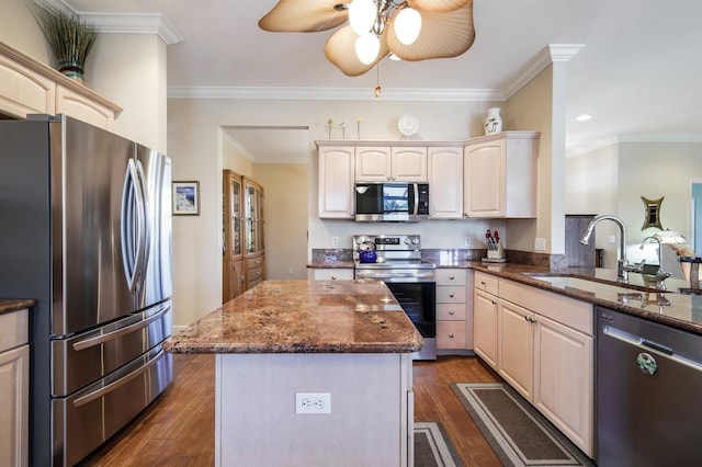 kitchen featuring dark hardwood / wood-style floors, stainless steel appliances, sink, ceiling fan, and dark stone counters