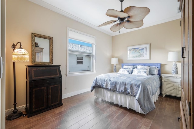 bedroom with ornamental molding, ceiling fan, and dark hardwood / wood-style floors