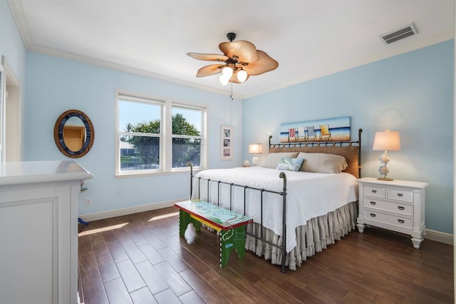 bedroom featuring ceiling fan, dark hardwood / wood-style flooring, and crown molding