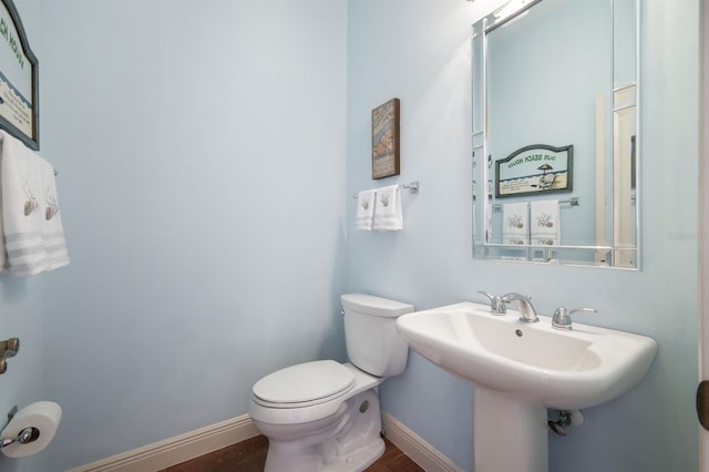 bathroom featuring toilet and hardwood / wood-style floors