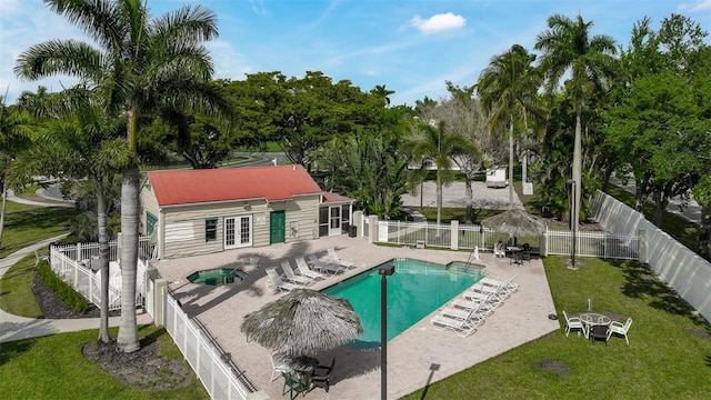 view of swimming pool with a lawn and a patio