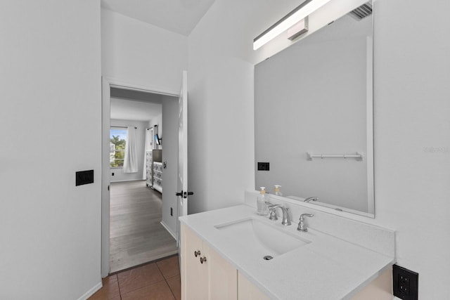 bathroom with tile patterned flooring and vanity