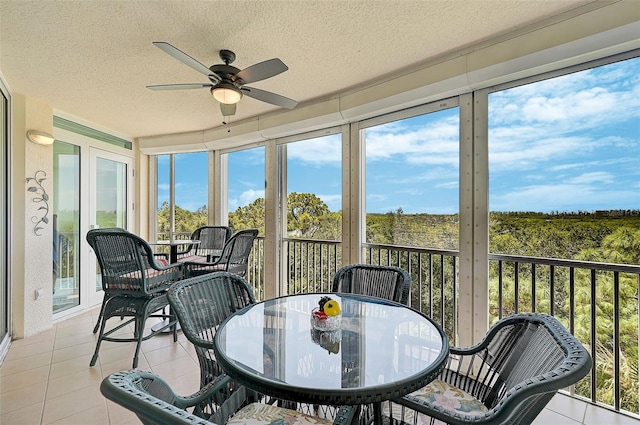 sunroom with plenty of natural light and ceiling fan