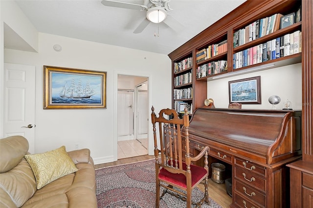 office featuring ceiling fan and light hardwood / wood-style floors