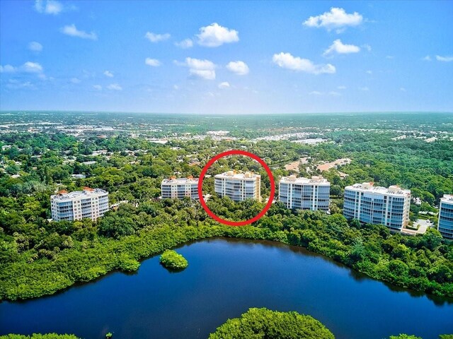 birds eye view of property with a water view