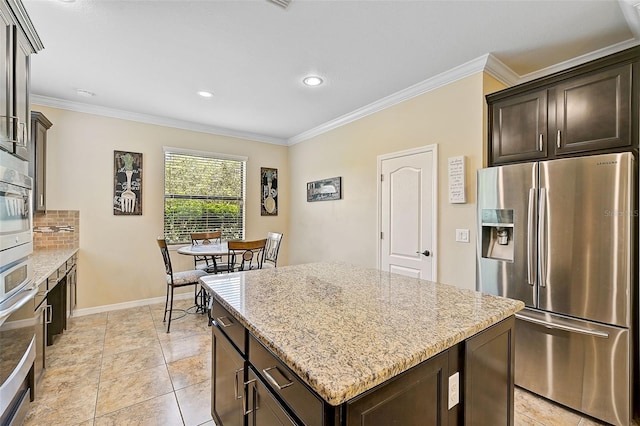 kitchen with a center island, dark brown cabinets, stainless steel refrigerator with ice dispenser, and ornamental molding