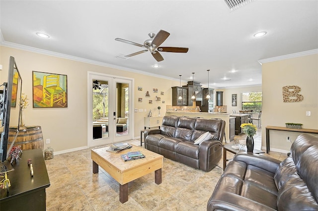 living room featuring visible vents, crown molding, baseboards, recessed lighting, and french doors