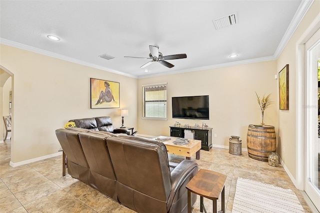 living room featuring arched walkways, visible vents, and ornamental molding