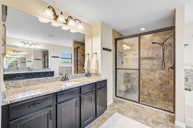 bathroom featuring a stall shower and vanity