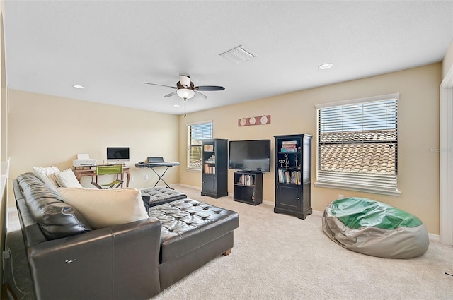 carpeted living room with recessed lighting, ceiling fan, visible vents, and baseboards