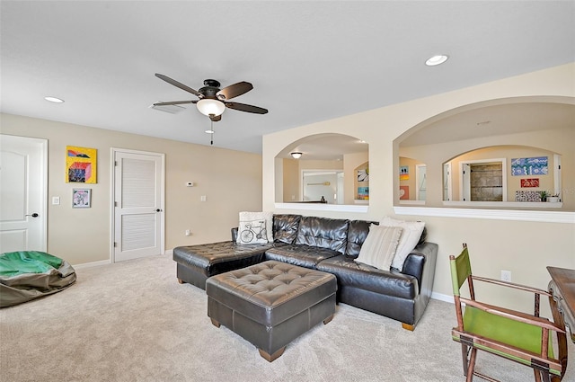 carpeted living area featuring recessed lighting, a ceiling fan, and baseboards