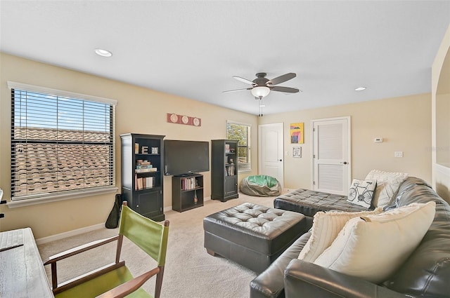 carpeted living area with recessed lighting, baseboards, plenty of natural light, and ceiling fan