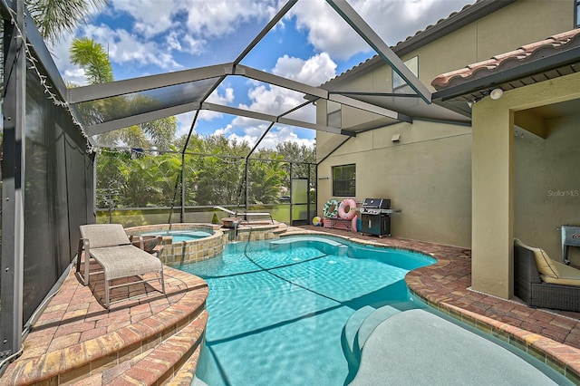 view of pool with a patio area, a grill, a pool with connected hot tub, and a lanai