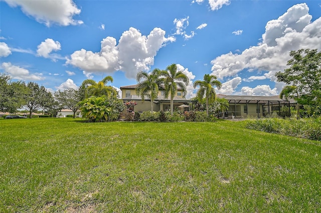 view of yard with a lanai