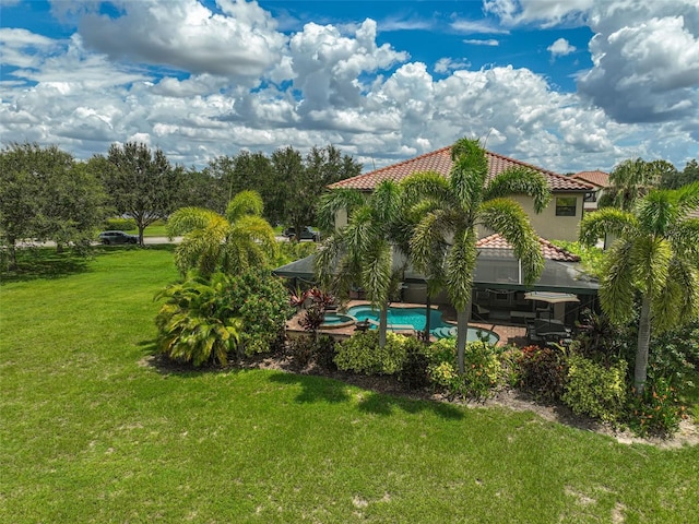 view of yard featuring an outdoor pool and a patio