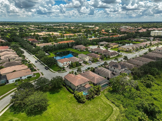 aerial view with a residential view and a water view