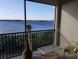 balcony featuring a water view