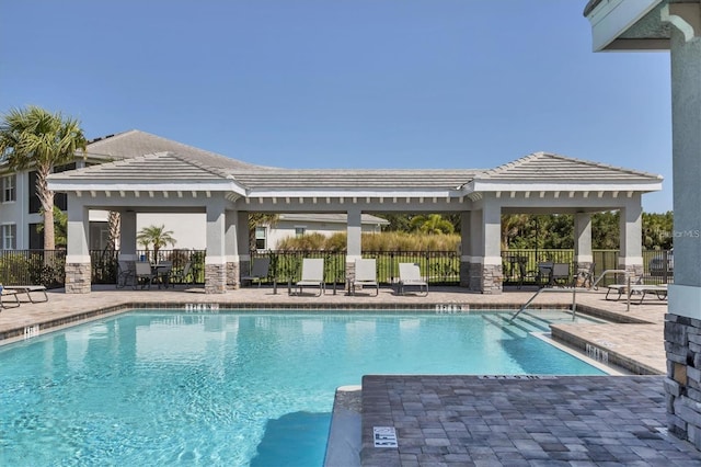 view of pool with a patio and a gazebo