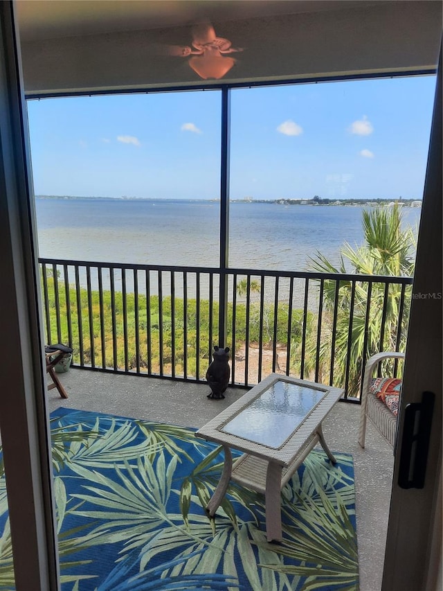 balcony featuring a water view