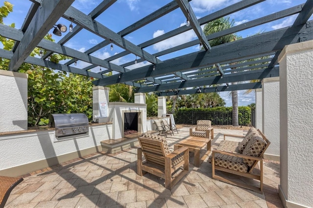 view of patio / terrace with a pergola, grilling area, and an outdoor living space with a fireplace