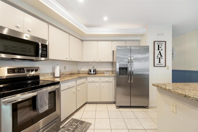 kitchen with crown molding, white cabinetry, light stone counters, appliances with stainless steel finishes, and light tile patterned flooring