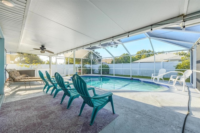 view of pool with a patio area, ceiling fan, and a lanai