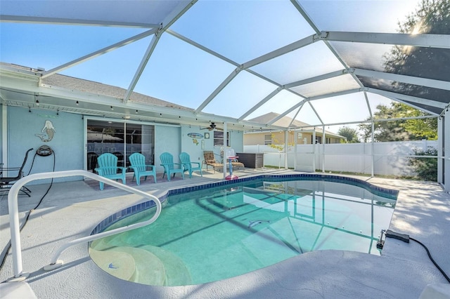 view of swimming pool featuring a lanai and a patio