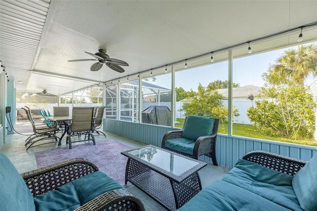 sunroom / solarium with ceiling fan and a healthy amount of sunlight