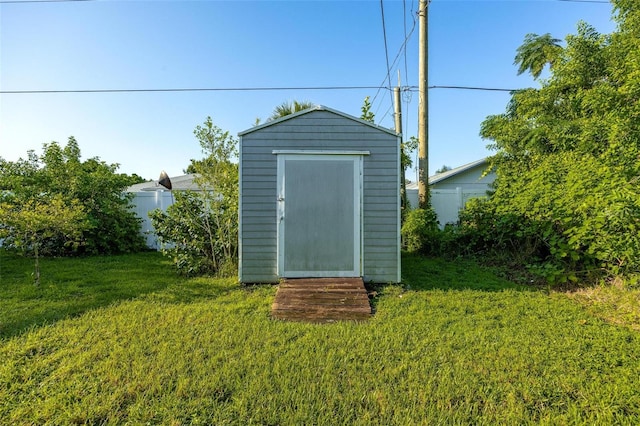 view of outbuilding with a lawn