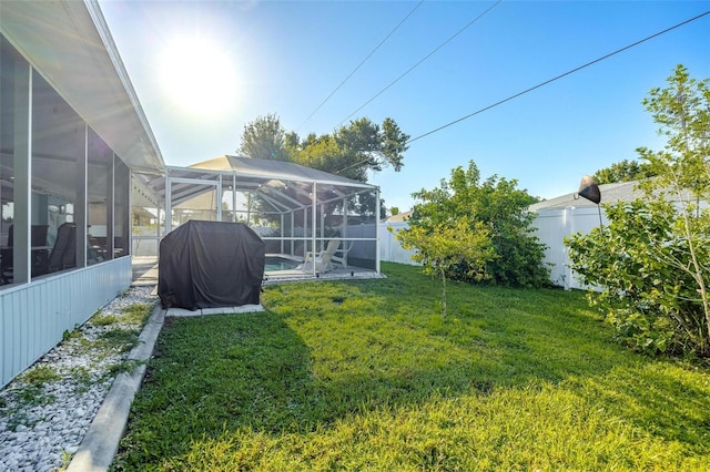 view of yard with a lanai