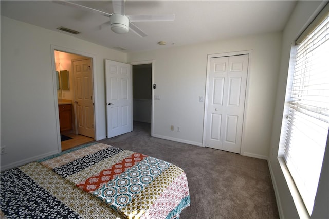 carpeted bedroom with ceiling fan, a closet, and ensuite bathroom