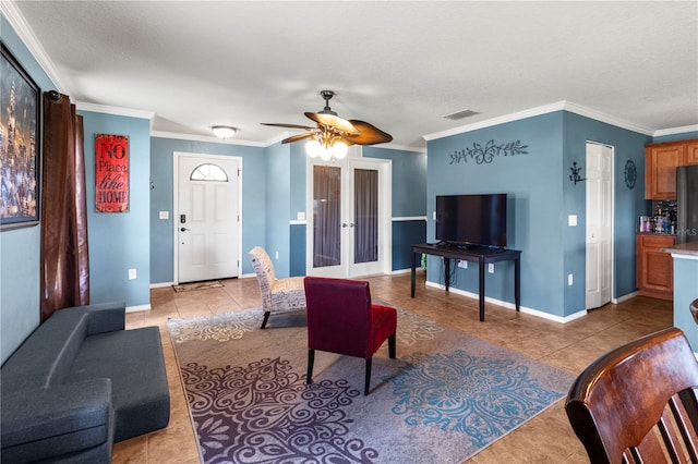 tiled living room with ceiling fan, crown molding, and a textured ceiling