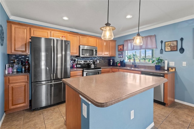 kitchen with appliances with stainless steel finishes, hanging light fixtures, decorative backsplash, and a kitchen island